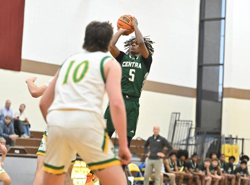 Plainfield Central's Treyvon Smith (5) soars for a jumpshot  during the WJOL tournament game against Providence Catholic on Friday, NOV. 28, 2025, at Joliet.