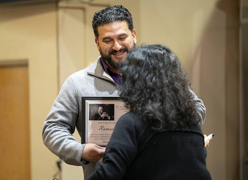 Teacher and youth leader Ramses Arreola is given the Peace and Justice Award Sunday, Jan. 19, 2025, by Irma Linda Lewis in Sterling. Though not present, Dr. Shirley Vazquez was also awarded for her mental health work.