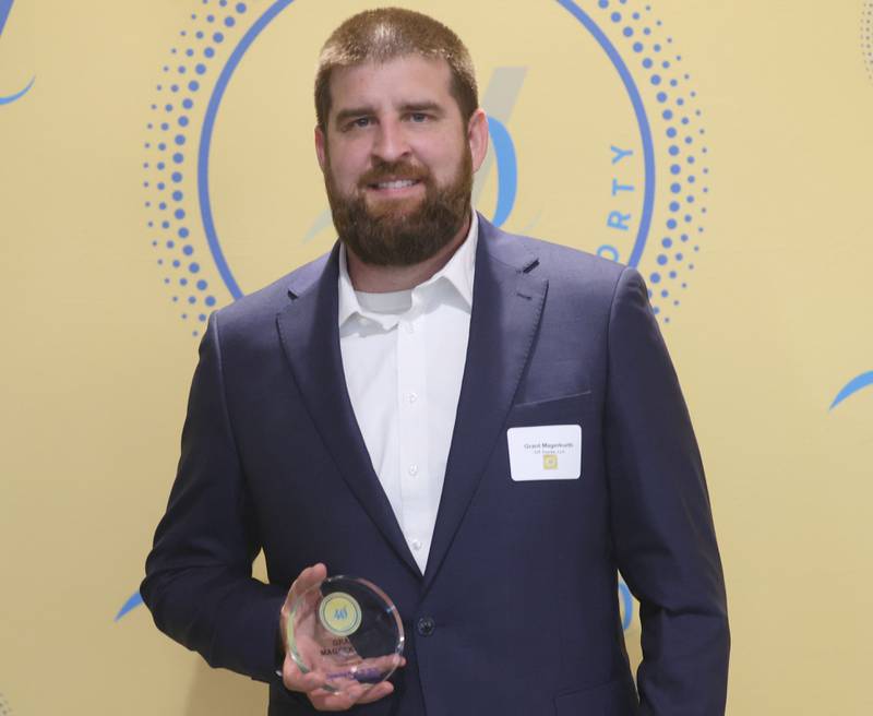 Grant Magerkurth poses with his 40 Under Forty award during the Illinois Valley Chamber of Commerce Champions of Change Awards Night on Wednesday, May 6, 2026 at the Westclox Event Center in Peru.