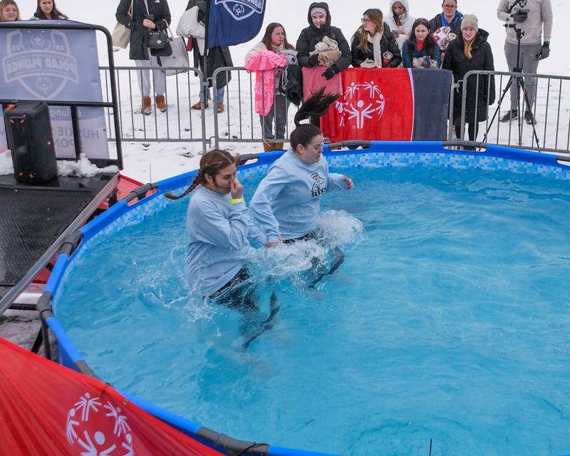 Participants jump into the pool on Saturday, Feb. 15, 2025, during the 2nd annual Polar Plunge at Northern Illinois University's Huskie Stadium in DeKalb. Proceeds benefited the law enforcement torch run for Special Olympics.