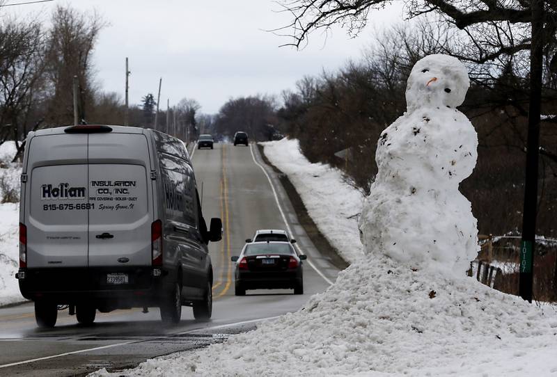 A giant snowman greets motorists traveling between Woodstock and Bull Valley on Illinois Route 120 Friday, March 10, 2023. Woodstock had one of the highest snow totals from the winter storm that rolled through Thursday afternoon into Friday morning, according to the National Weather Service in Romeoville.
Snow totals throughout northern Illinois ranged from a half-inch reported in Batavia to 9.6 inches in Bull Valley, NWS Meteorologist Zachary Yack said.