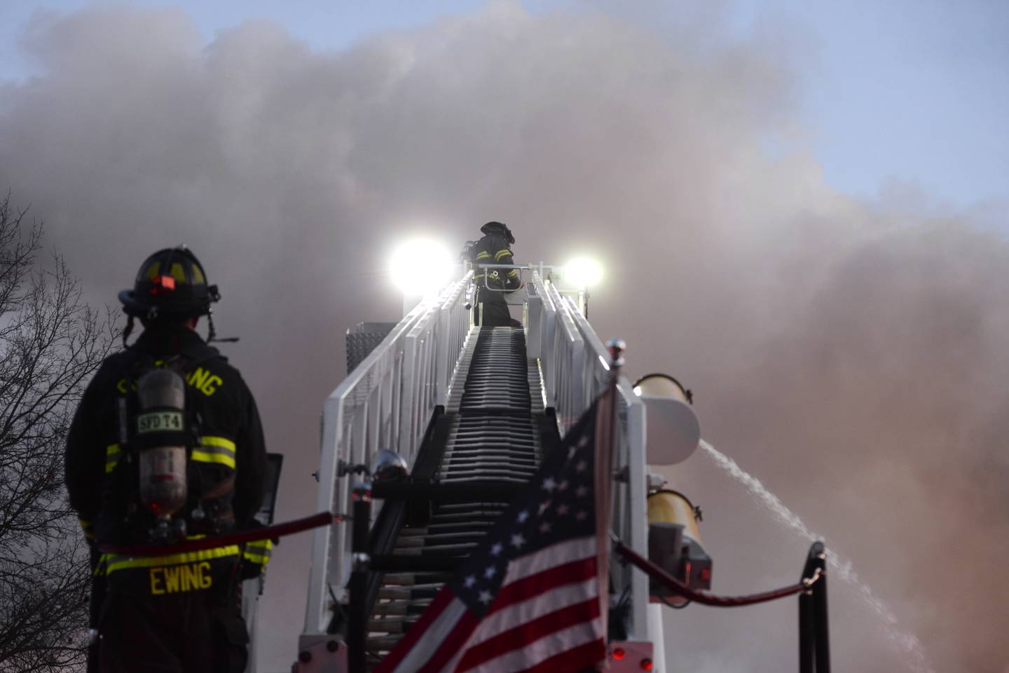 Firefighters from Sterling use their ladder truck to fight a fire at 5500 Mill St. in Emerson on Sunday, Jan. 19, 2025. Fire crews battled frigid temperature for several hours well into the evening.