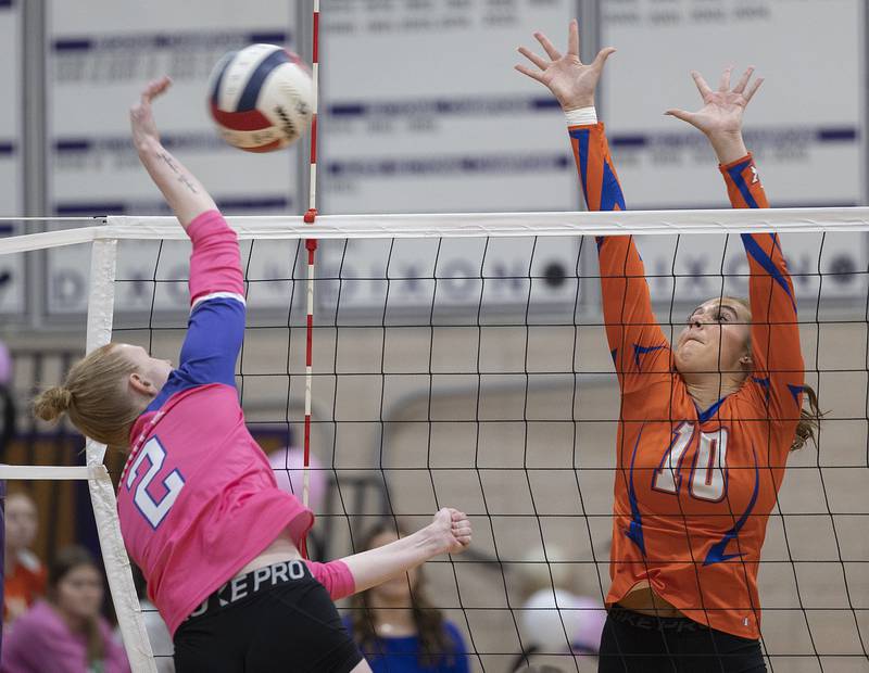 Genoa-Kingston’s Bria Botterman goes up to block a shot by Dixon’s Madyson Tichler Thursday, Oct. 17, 2024.