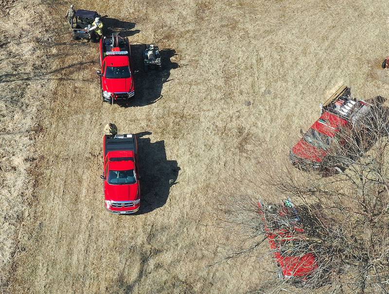 Firefighters gather on the scene with ATV's and 6-wheelers to fight a large brush fire near Interstate 180 and the Hennepin Canal on Tuesday, Feb. 10, 2026 near Princeton. A Mutual Aid Box Alarm (MABAS) was dispatched around 12:30p.m. Bureau County Fire departments from Bureau, Ladd, Wyanet, Princeton, Hennepin and others assisted with the brush fire.