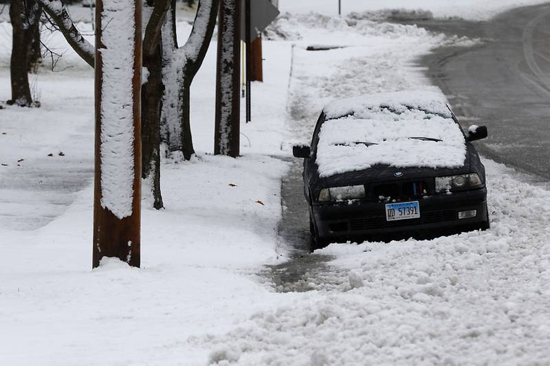 Snow covers a car parked in the 5700 block of Broadway Street in Richmond on Friday,  Dec. 9, 2022, in Richmond. Areas of McHenry County received a couple of inches on snow after a winter storm moved through the county.