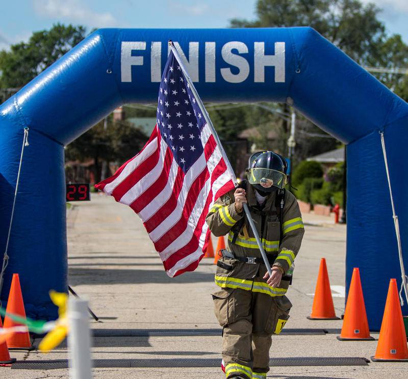 Crystal Lake firefighter runs half marathon in full gear, tank and all