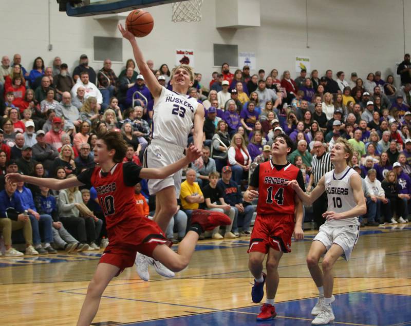 Serena's Tanner Faivre eyes the hoop as Earlville's Easton Fruit and Oliver Munoz defend during the Little Ten Conference Championship on Friday, Feb. 2, 2024 at Somonauk High School.