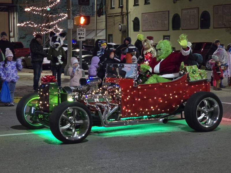 The Grinch waves to the crowd Saturday, Nov. 30, 2024, during the Lighted Christmas Parade in Streator.
