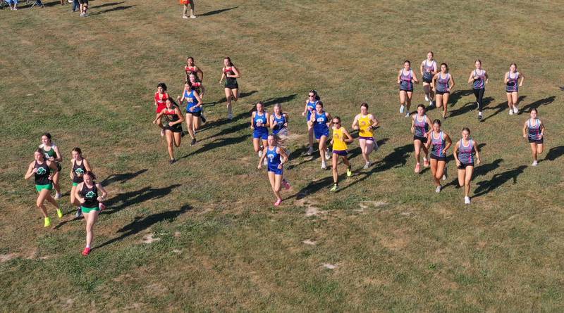 Girls cross country teams leave the starting line during the Ottawa Nautical Mile Relay on Tuesday, Sept. 2, 2025 at Catlin Park in Ottawa.