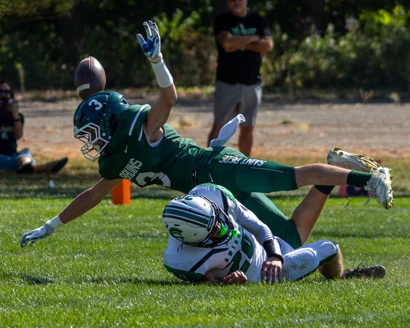 Stuart McGunnigal (3) of St. Bede misses pass and falls over Tysen Walker (20) of Dwight on Saturday, Oct. 4, 2025 at Captain Thomas J. Heitmann field in Peru.