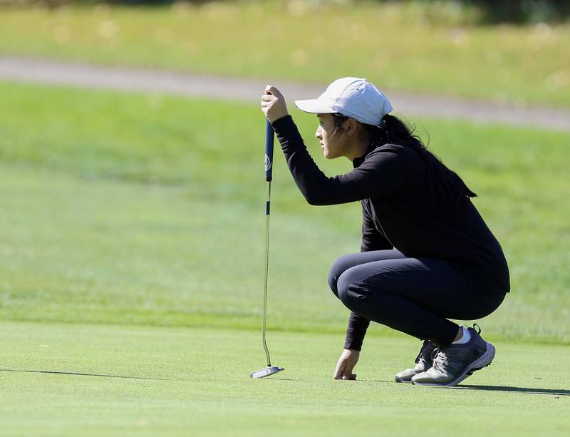 Amanda Nguyen of Glenbard North, lines up her putt during the IHSA Class 2A West Chicago girls golf regional at St. Andrews Tuesday, Oct. 1, 2024 in West Chicago.