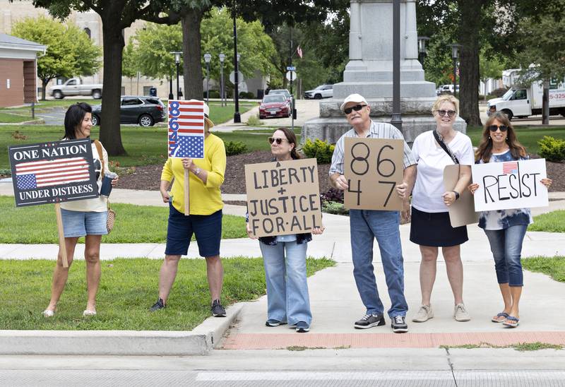 Protesters line East Fourth Street in Sterling on Thursday, July 17, 2025.