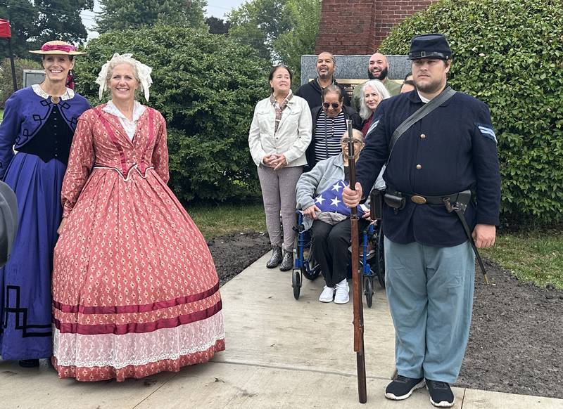 Bureau County Historical Society members and The Clarke Family poses next to the monument in honor of their family member Charles Moses Sr during a Civil War Monument Ceremony on Friday, Sept. 22, 2023 outside the Sash Stalter Matson Building in Princeton. The memorial honors 45 black troops who lived in Bureau County and fought in the Civil War.