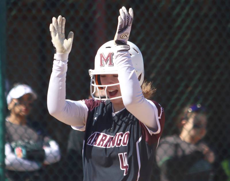 Marengo’s Jozsa Christiansen celebrates scoring as she was along for the ride on an AJ Pollnow grand slam against North Boone in varsity softball at Marengo High School in Marengo on Saturday, March 22, 2025.