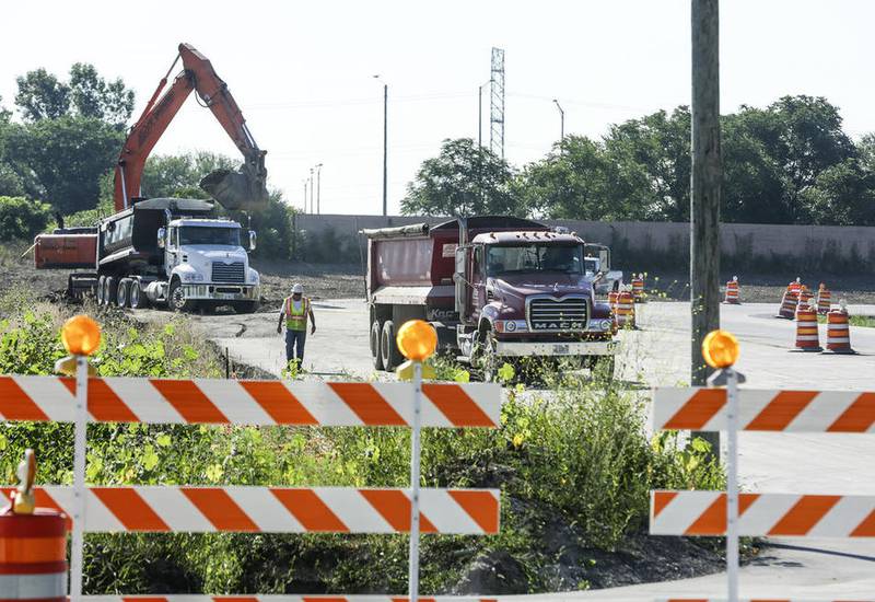 Construction crews work Thursday near the on ramp from Route 30 to Interstate 55 in Joliet.