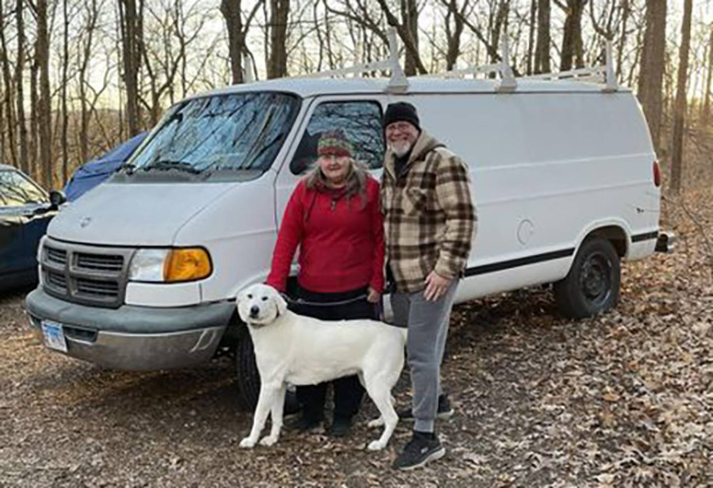 Sarah Wright and her dog Luna, by the van that was donated to her by Brad Parkinson of Oregon. Parkinson, pictured with Wright, has spearheaded an effort to help Wright after he saw her camping in a tent at Lowden State Park after being unable to find rental property that would allow her to keep Luna and her three cats.