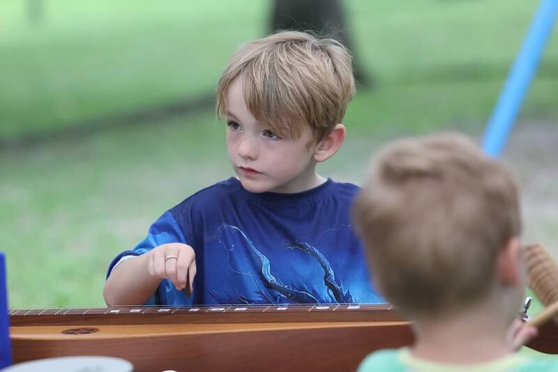 Benji Garon-Perez plays on a dulcimer at the Gebhard Woods Dulcimer & Traditional Music Festival on Saturday June 8, 2024 in Morris.