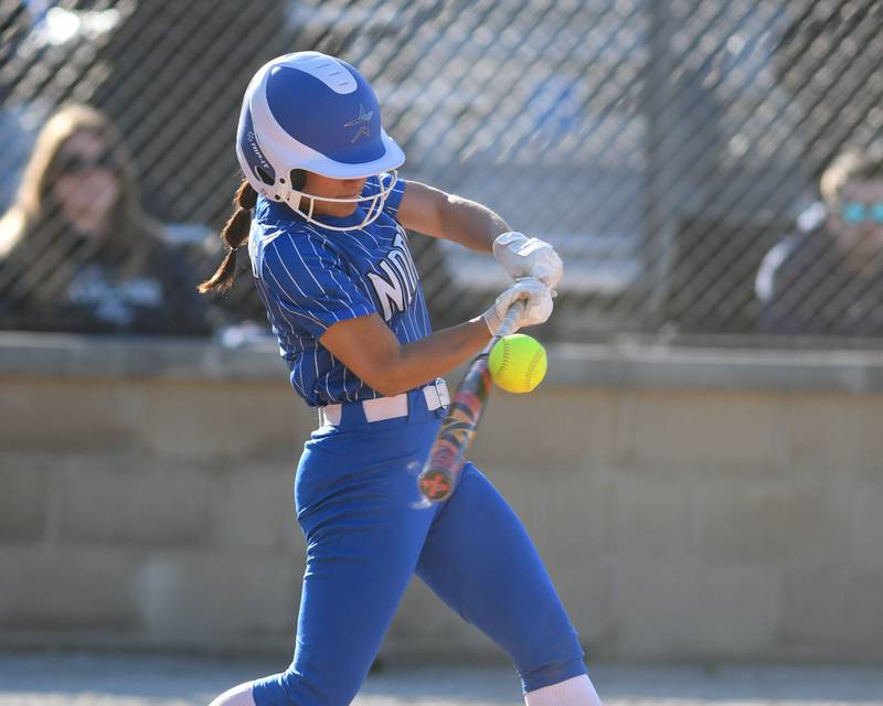 St. Charles North's Maddie Hernandez (2) makes contact with the ball but was thrown out at first base during the game on Wednesday April 24, 2024, while traveling to take on Lake Park High School.