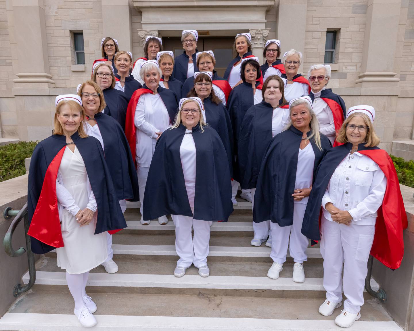 Members of the Illinois Valley Nurse Honor Guard pose for a group photo on the steps of the Holy Rosary Memorial Shrine on May 21, 2025 in LaSalle.