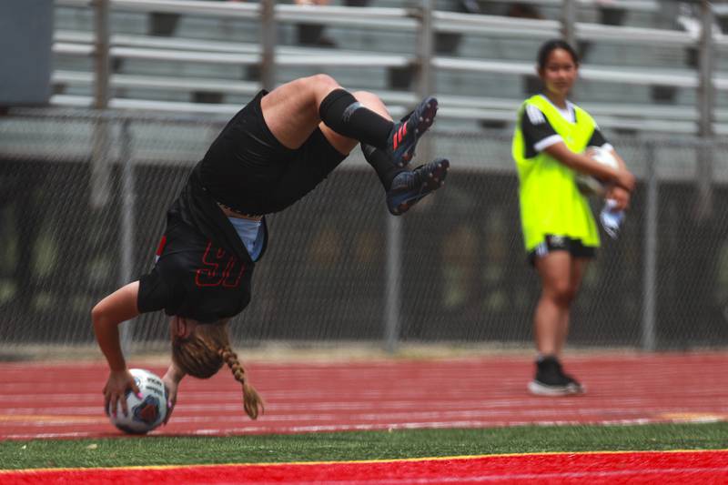 Lincoln-Way Central midfielder Grace Grundhofer launches the ball into the box from a flip throw-in on Saturday, May 22, 2021, at Lincoln-Way East High School in New Lenox, Ill.