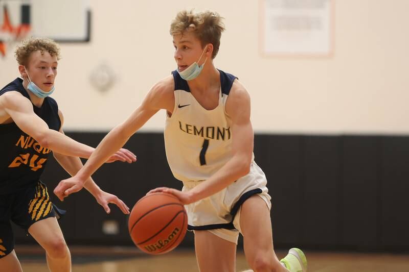 Lemont’s Matas Castillo drives to the basket against Neuqua Valley in the Warrior Showdown shootout at Lincoln-Way West. Saturday, Jan. 29, 2022 in New Lenox.