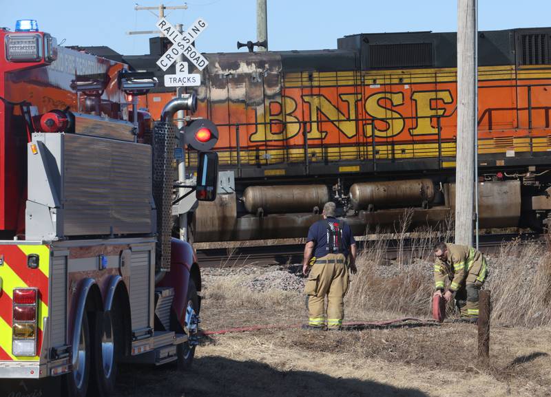 Toluca-Rutland firefighters wind up hoses as they begin to depart the scene of a BNSF locomotive that was leaking fuel near the intersection of 2900 East Street and 500 North Avenue on Wednesday, Feb. 18, 2026 near Toluca. A Mutual Aid Box Alarm System (MABAS) call was sent out shortly after 1p.m but canceled.