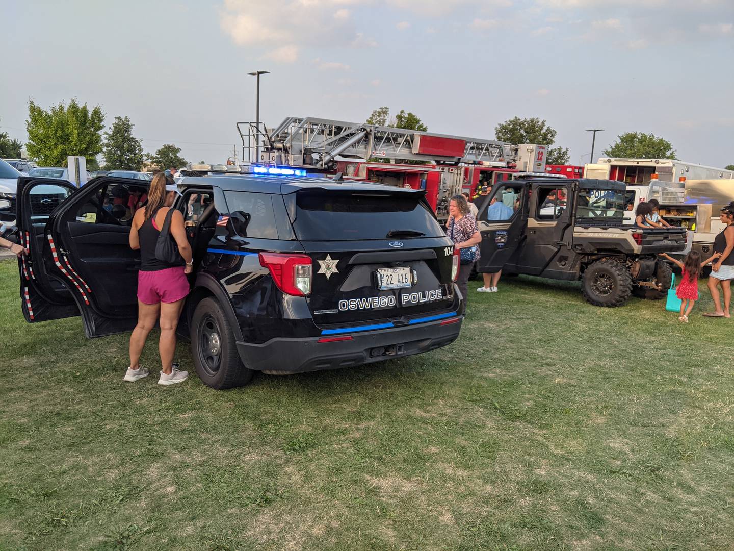 People look at the vehicles on display at National Night Out on Aug. 5 at Prairie Point Community Park.