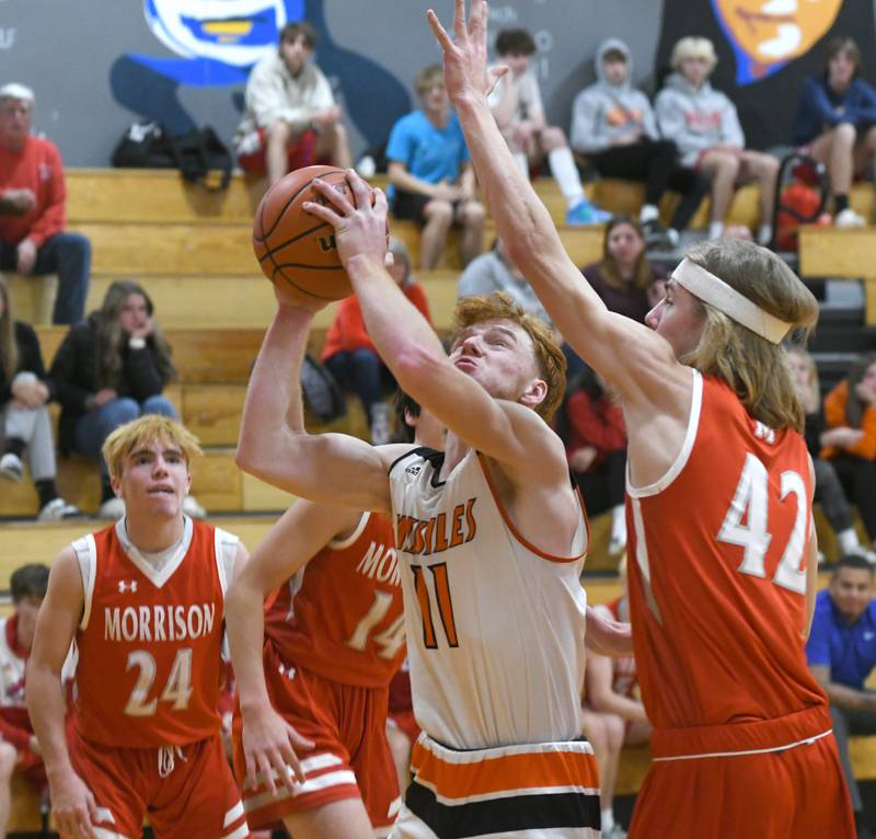 Milledgeville's Connor Nye shoots as Morrison's Brenden Martin defends during Friday, Nov. 25 action at the Oregon Thanksgiving Tournament.