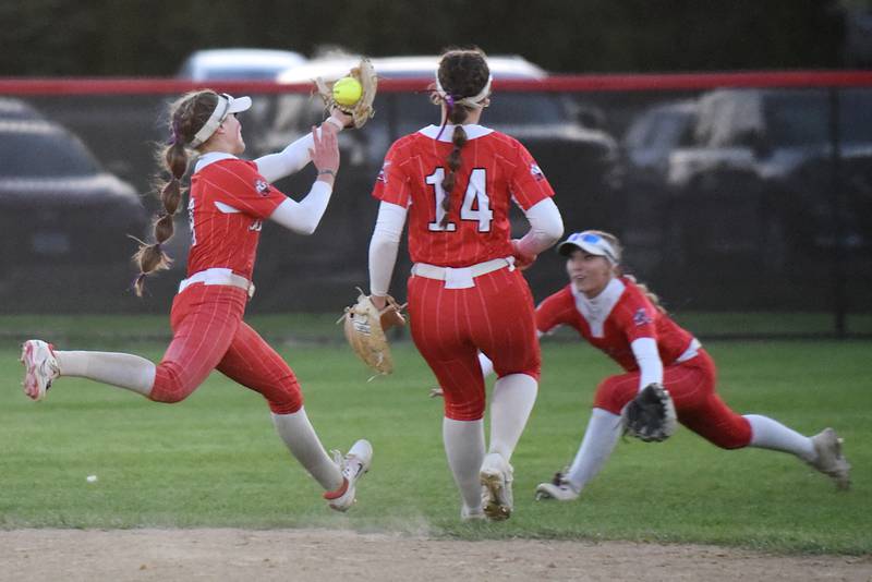 Bradley-Bourbonnais' Shannon Lee, left, makes a catch in front of a diving Bella Pusateri, right, as Olivia Woolman looks on during a home game against Bishop McNamara Thursday, May 8, 2025.