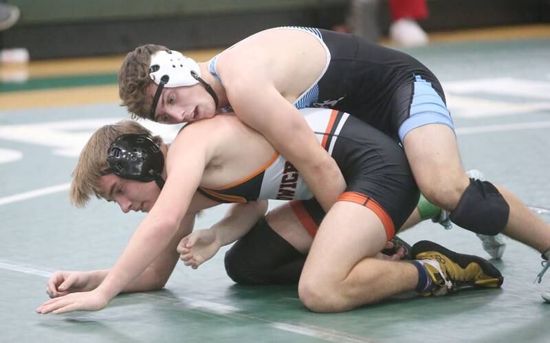 Marquette's Beau Thompson wrestles Sandwich's Jaxsen Blanchard  in the 138 pound weight class during the Class 1A Regional meet on Saturday, Feb. 8, 2025 at St. Bede Academy.