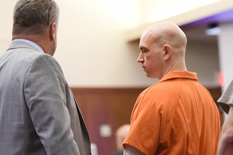 Matthew Plote (right) speaks with his attorney Liam Dixon following an April 6 hearing in Ogle County. He is accused of killing Melissa Lamesch of Mt Morris and her unborn child in 2020.
