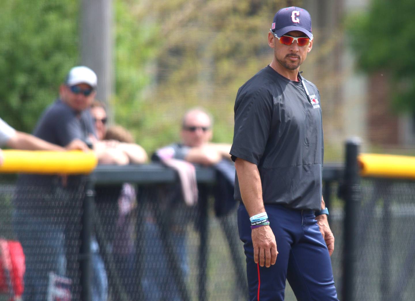 Conant Head Coach Derek Fivelson  guides his team against Hampshire in varsity baseball at Hoffman Estates Saturday.