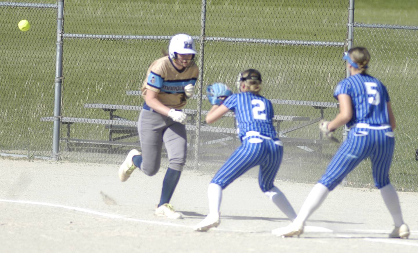 Newman third baseman Brenleigh Cook gets ready to tag a player in a rundown while shortstop Lucy Oetting backs up the play. Marquette traveled to Newman' to play a game on Friday, May 16, 2025.