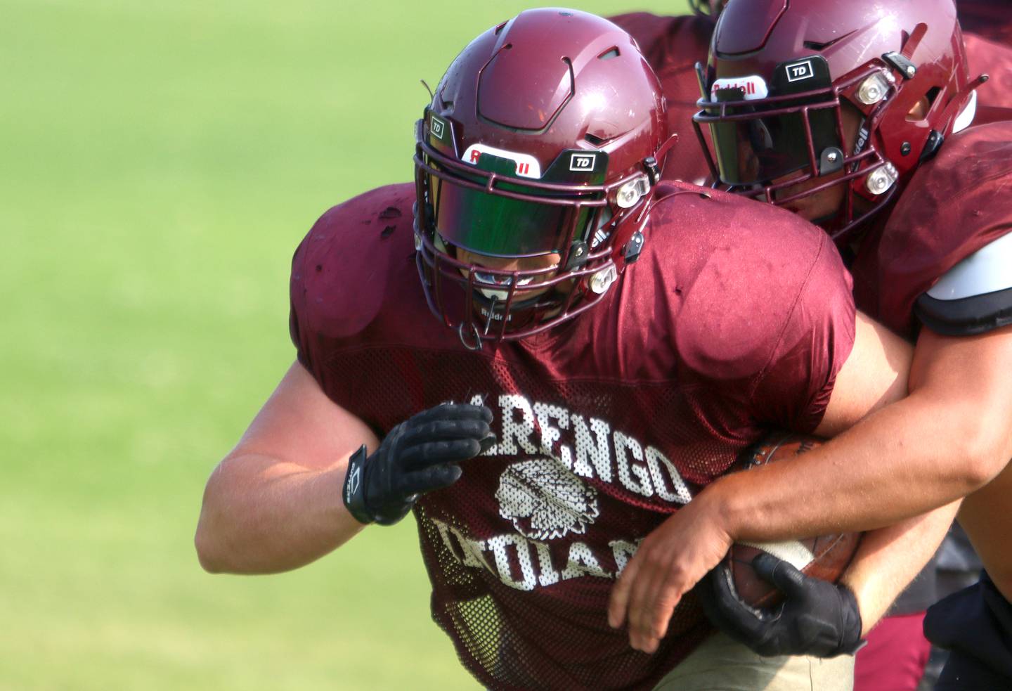 Rune Boyd runs through a drill during Marengo High School football practice Tuesday morning.