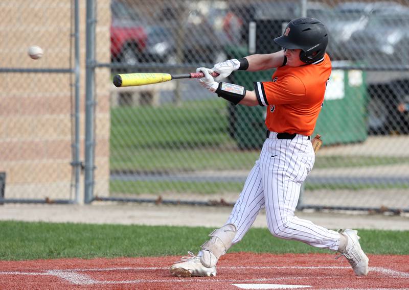 DeKalb's Nikolas Nelson makes good contact Monday, April 28, 2025, during their game against Naperville Central at DeKalb High School.