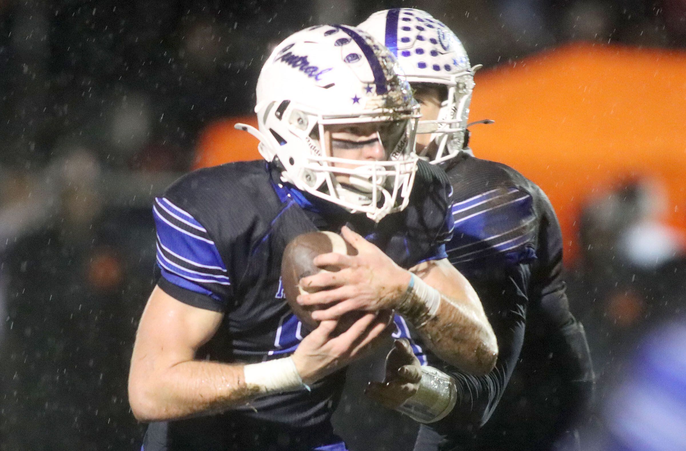 Burlington Central’s Tyler McGladdery moves with the ball against Harlem in IHSA football Class 6A second-round playoff action at Central High School in Burlington on Saturday, November 8, 2025.