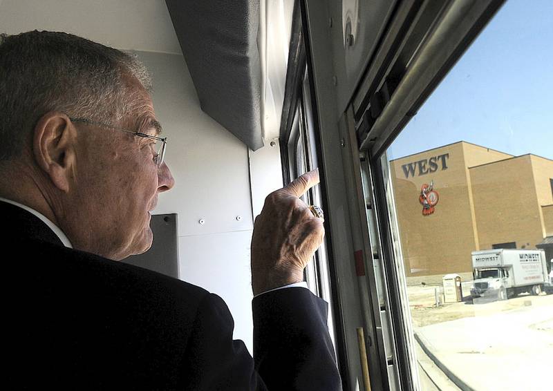 Former Lincoln-Way Superintendent Lawrence Wylie points to an entrance to the then-new Lincoln-Way West High School in May 11, 2009. The school was built after a 2006 referendum passed to accommodate an expected influx of students that never came. Now, district leaders are considering shuttering one of Lincoln-Way's four academic buildings to deal with financial problems.