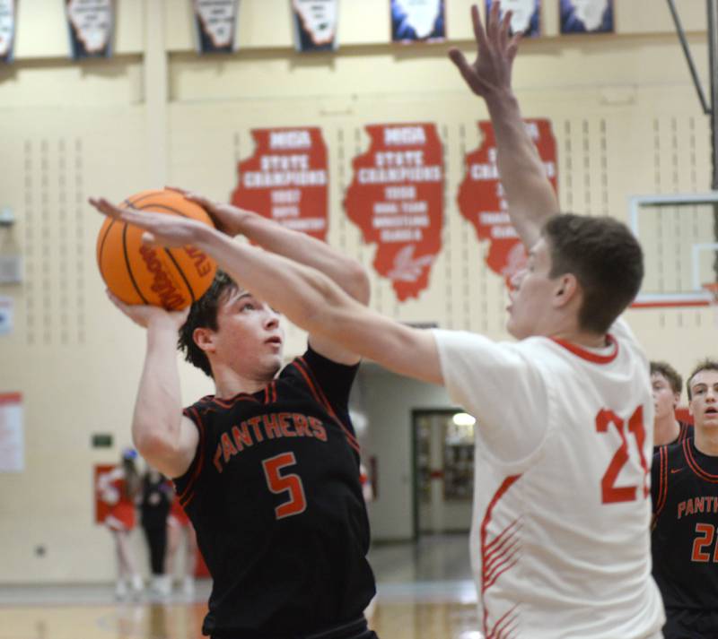 Erie-Prophetstown's Max Milem (5) shoots as Oregon's Tucker O'Brien (21) defends during 2A regional action on Monday, Feb. 24, 2025 at the Blackhawk Center in Oregon.