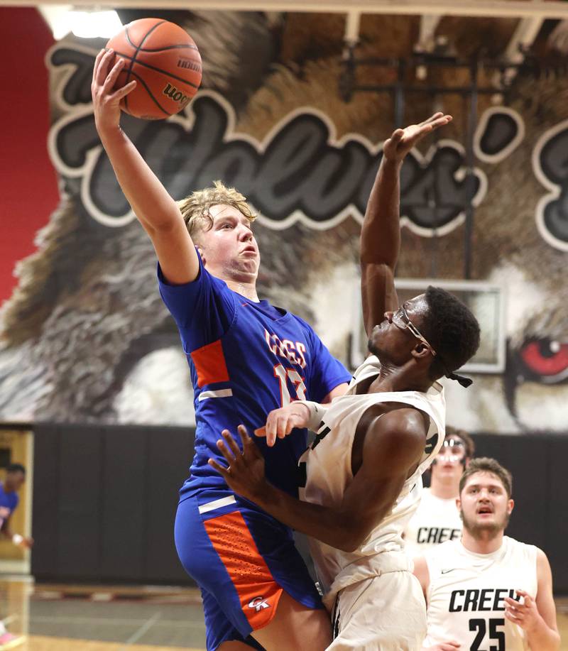 Genoa-Kingston's Hayden Hodgson goes strong to the basket against an Indian Creek defender Wednesday, Jan. 25, 2023, during their game at Indian Creek High School in Shabbona.