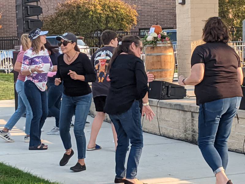 People dance to tribute band Billy Elton during Pouring For Pink: Breast Cancer Benefit Concert on Oct. 12 at Venue 1012 in Oswego.
