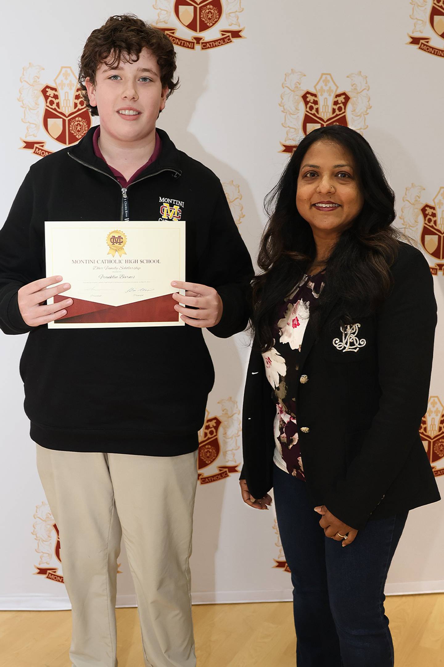 Franklin Barnes (’27) has been awarded Montini Catholic High School's 2025 Dhir Family Scholarship. It was presented by Mahima Dhir (right) on behalf of scholarship founders Anjay and Aayan Dhir.
