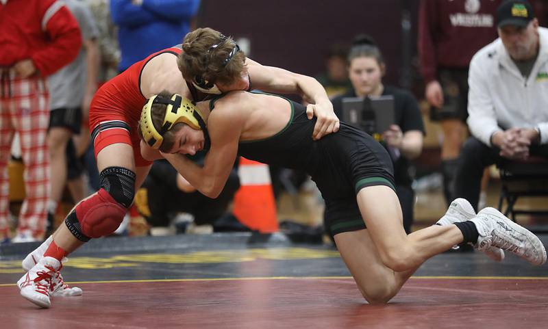 Crystal Lake South’s Logan Aarseth tries to get out of the grasp of Union Grove’s 
Camden Rugg during a 113-pound match in the Tom DuBois Invite wrestling meet on Saturday, Dec. 13, 2025, at Richmond-Burton High School in Richmond.