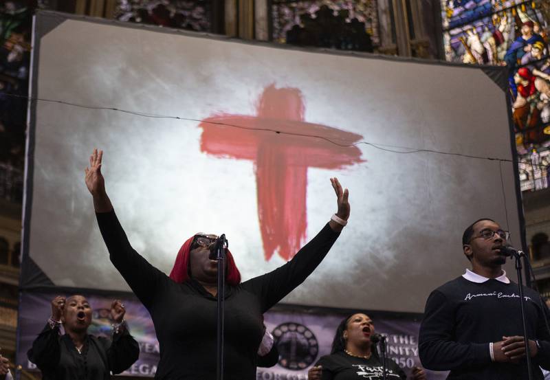 The New Mount Pilgrim Missionary Baptist Church choir, including Jennifer Hatch with arms raised, sings during a service Sunday, Sept. 7, 2025, in Chicago. (AP Photo/Carolyn Kaster)