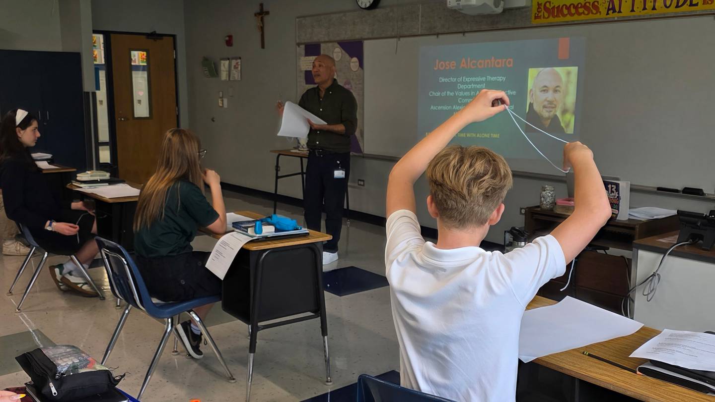 Art therapist Jose Alcantara speaks to Saints Peter and Paul eighth-graders in the Cary-based school's new leadership program on April 23, 2026.