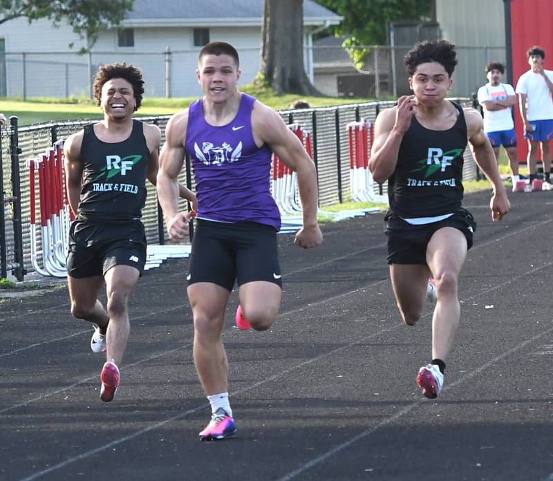 Rock Falls Adan Oquendo (left) grabs his hamstring as he races Dixon's Owen Belzer (center) and Rock Falls Alexavier Oquendo in the finals of the 100 meters at the Big Northern Conference Meet at Stillman Valley on Thursday, May 14, 2026.