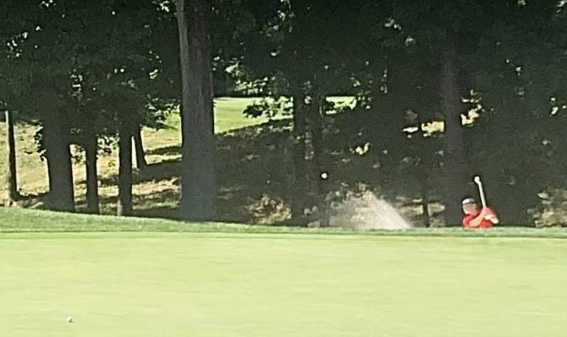 Hall's Landen Plym fires out of the No. 9 bunker at TPC Deere Run Monday.