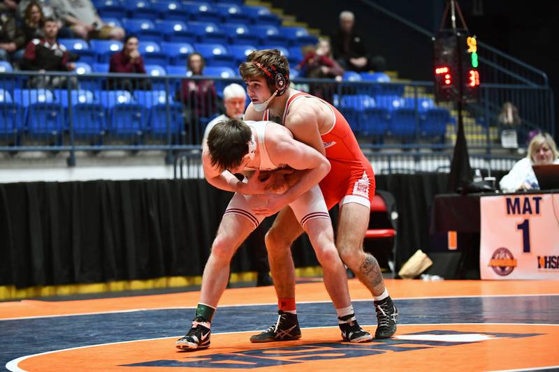 Vance Williams of Marian wrestles Holden Brazelton of Tolono Unity in the 150-pound match during the IHSA Dual Team State Finals in Bloomington on Saturday, March 1.