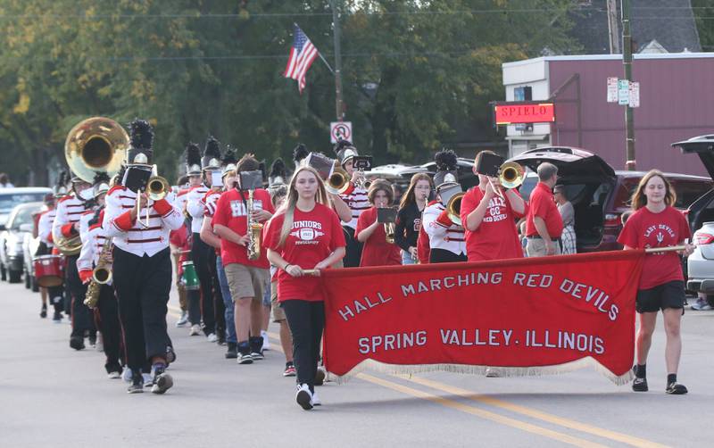 The Hall Marching Red Devils band strolls down St. Paul Street during the Hall High School Homecoming parade on Thursday, Sept. 28, 2023 in Spring Valley.