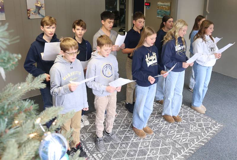 Marquette Academy 7th grade choir sings Christmas songs during the 175h annual Freezin’ for a Reezin’ event on Friday, Dec. 5, 2025 at WCMY in Ottawa. Donations support the Community Food Basket of Ottawa. Freezin’ for a Reezin’ featured nterviews with local celebrities, musical performances by several Ottawa school choirs and bands and, of course, the giving.