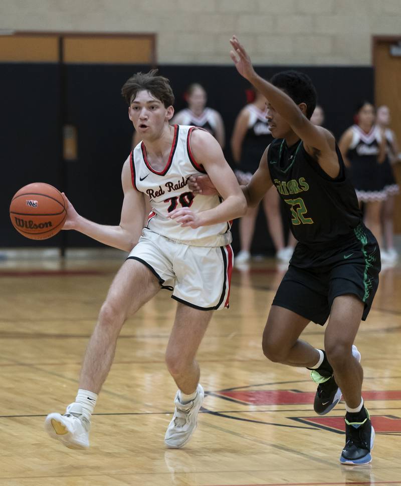 Huntley's Ethan Blackmore pushes past Crystal Lake South's Joshua Washington during their game on Friday, December 16, 2022 at Huntley High School. Ryan Rayburn for Shaw Local